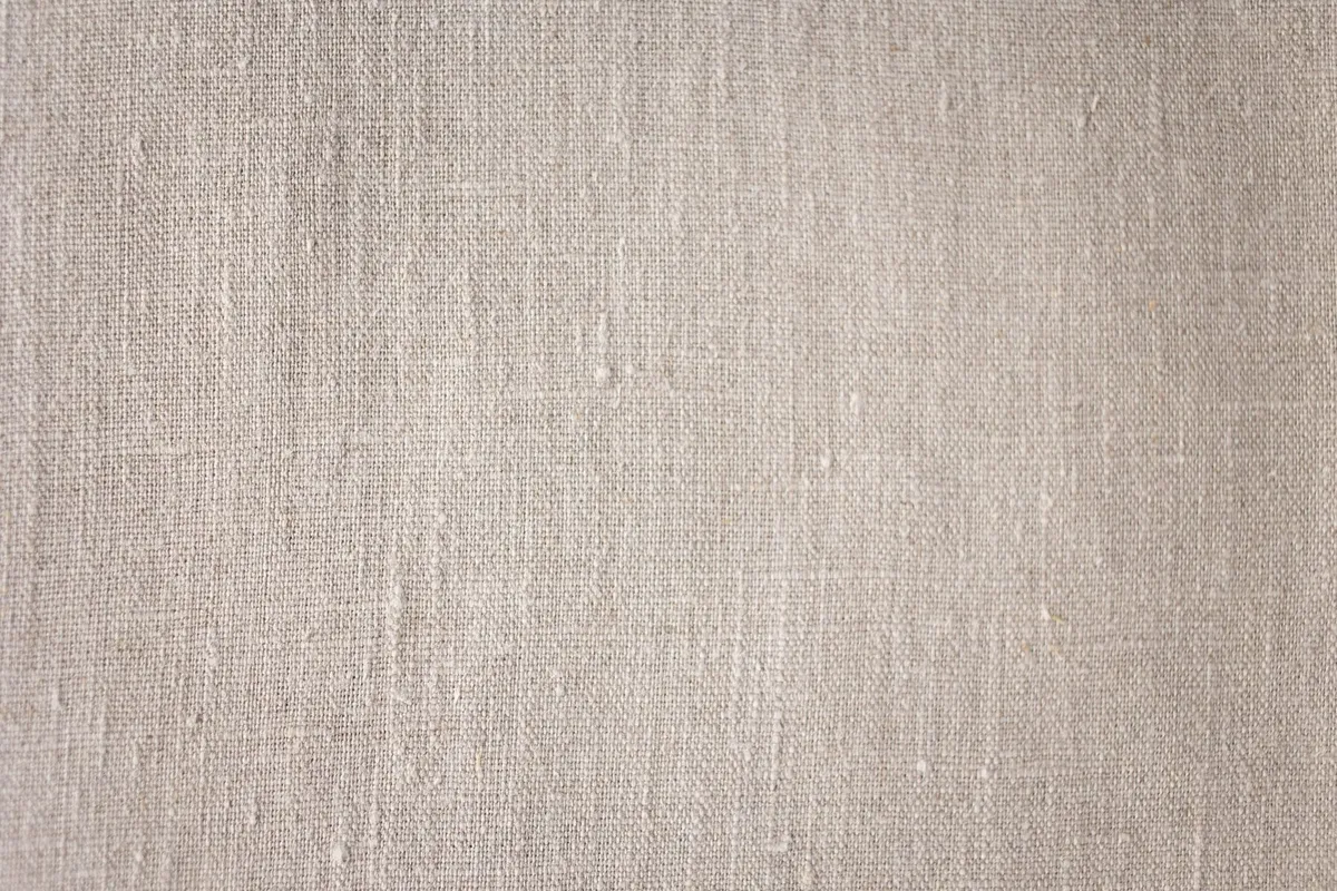Linnen weefsel in naturel tint, van dichtbij.